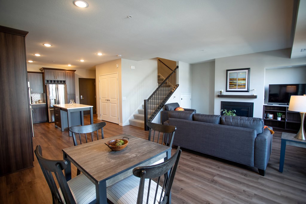 a living room and dining room with a couch and a table