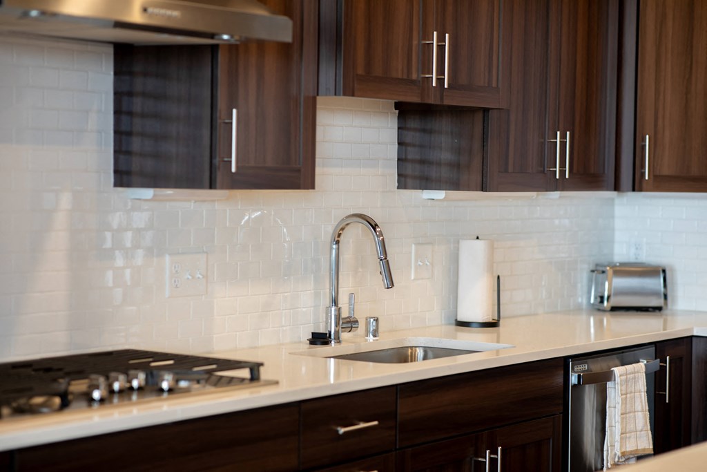 a kitchen with a sink and a counter top
