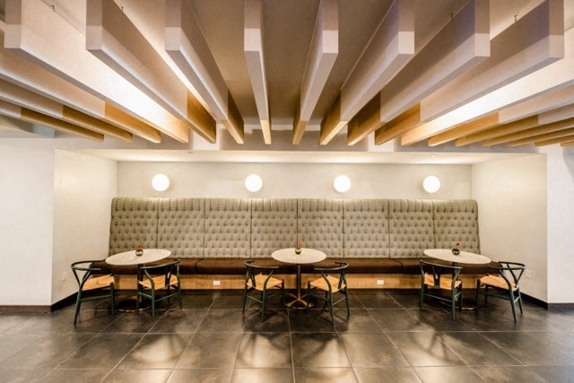 a dining room with tables and a couch