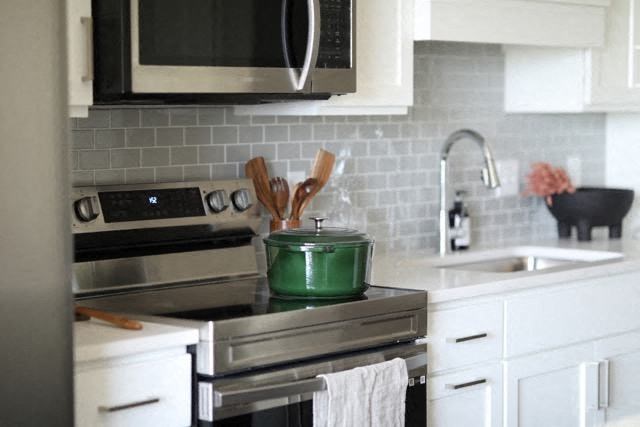 a kitchen with a stove and a sink
