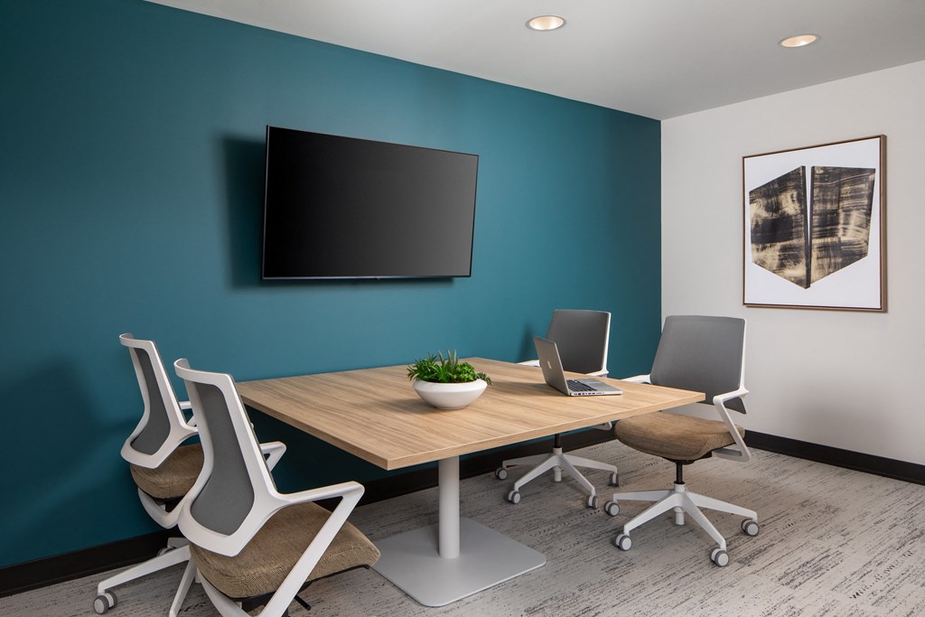 a conference room with a table and chairs