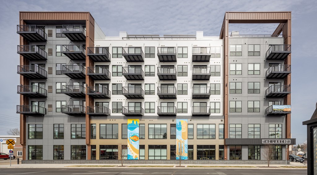 an apartment building on the side of a street