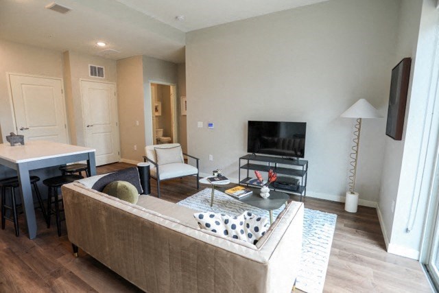 a living room with a couch a table and a television