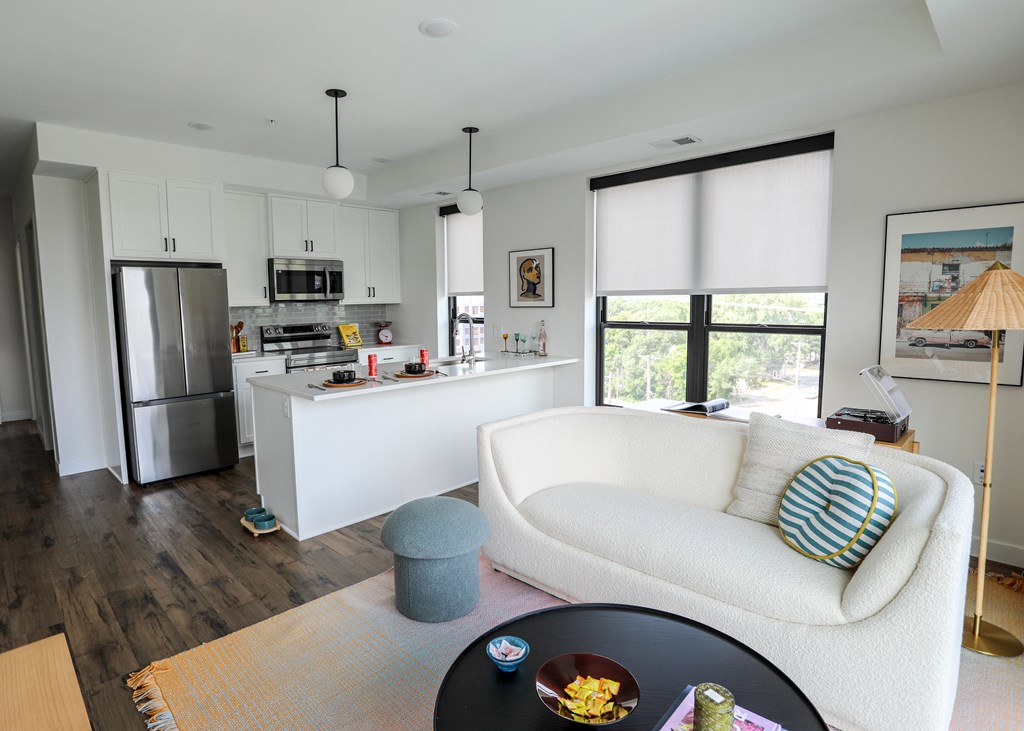 a view of the kitchen and living room from the dining room