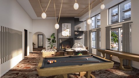A pool table is in the middle of a room with a fireplace and a balcony.