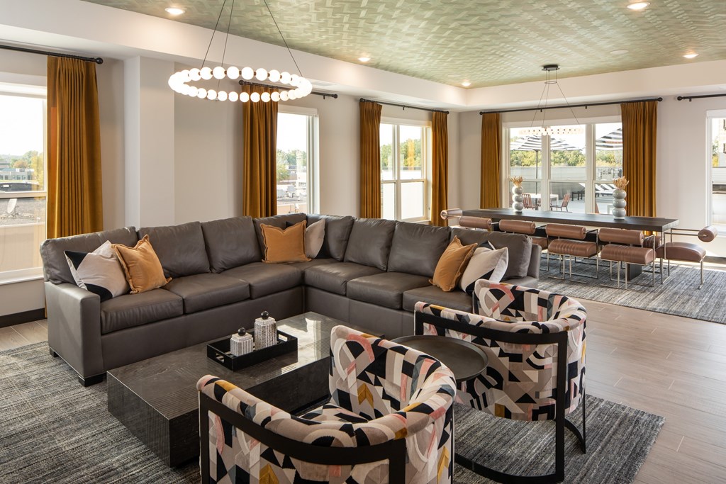 A modern living room with a grey sofa and a coffee table.