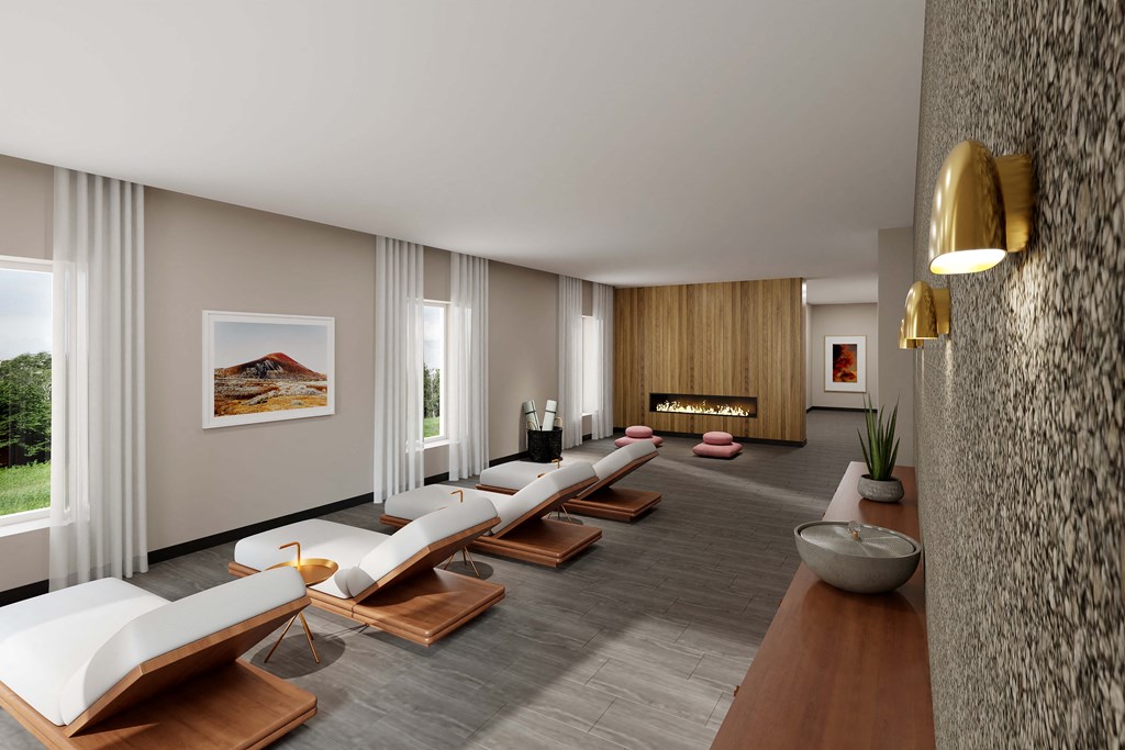 a living room with couches and chairs and a fireplace