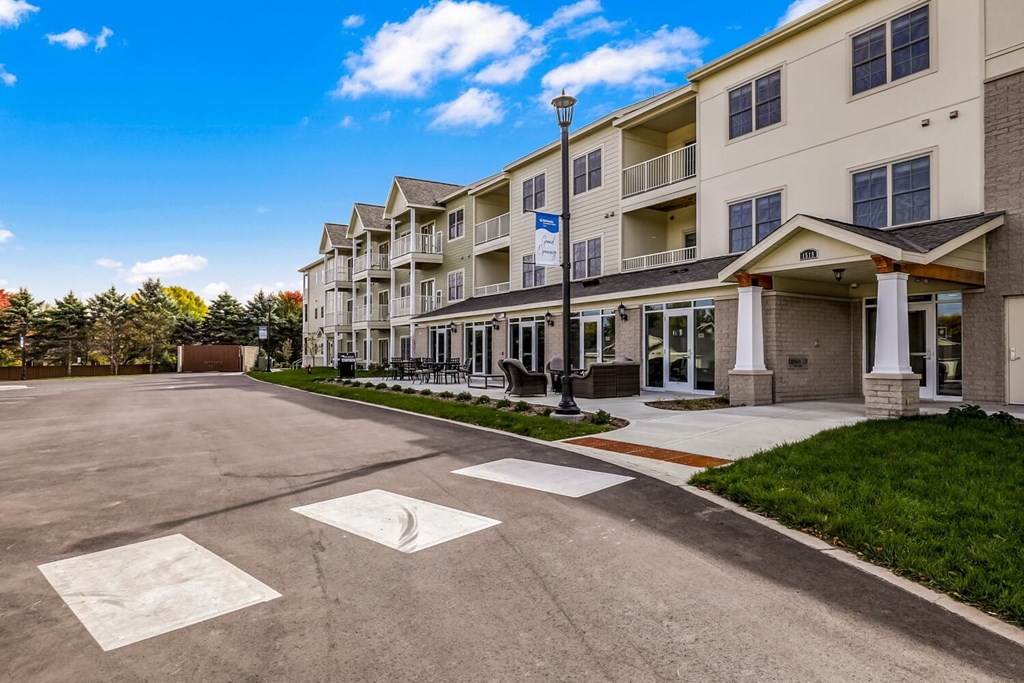 a large building with a parking lot in front of it