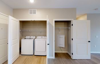 A laundry room with a washer and dryer in it.