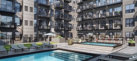 an image of an apartment complex with a pool and hot tub