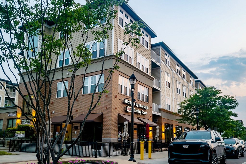 a building on a city street with cars