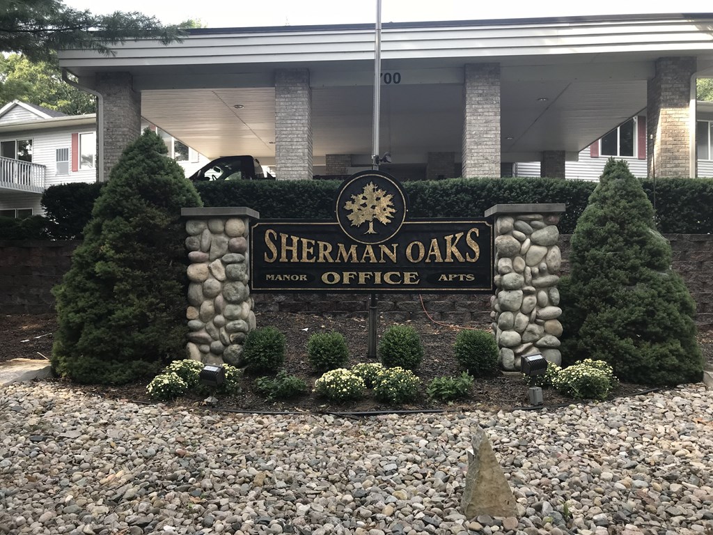 a sign for in front of a building