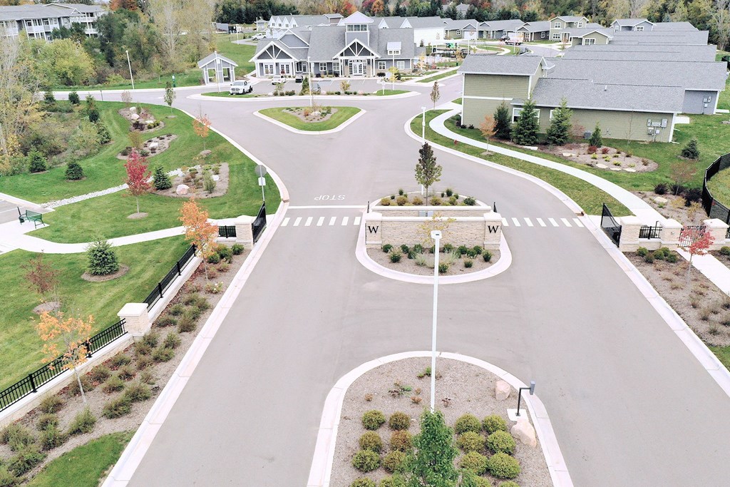 an aerial view of a neighborhood with a street and houses