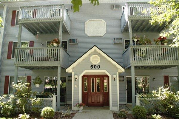 the front of a house with a red door
