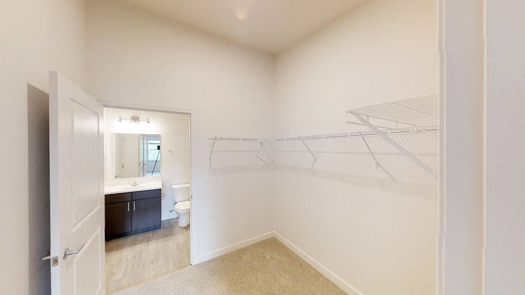 a bathroom with a shower and a sink and a toilet