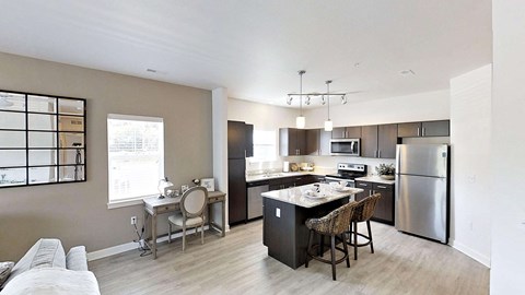 a kitchen with stainless steel appliances and a counter top
