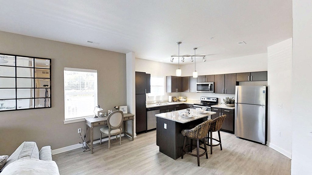 a kitchen with stainless steel appliances and a counter top