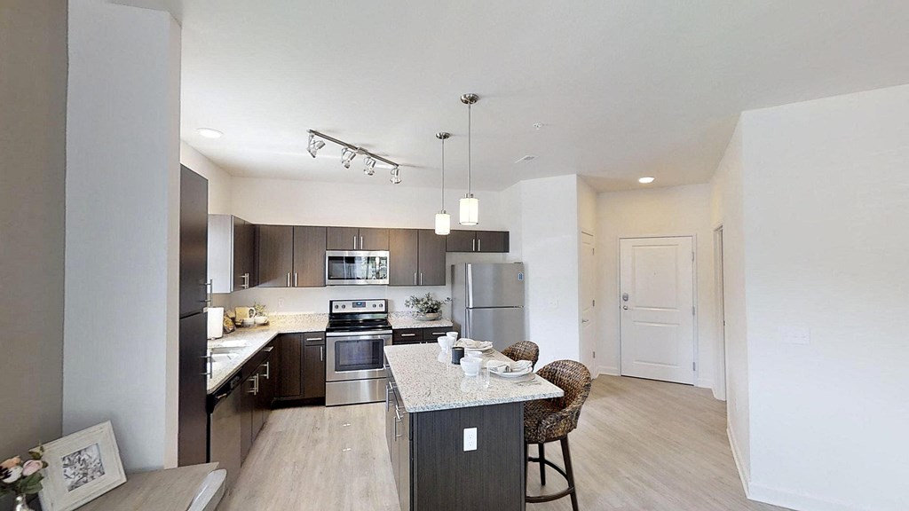 a kitchen with stainless steel appliances and a counter top