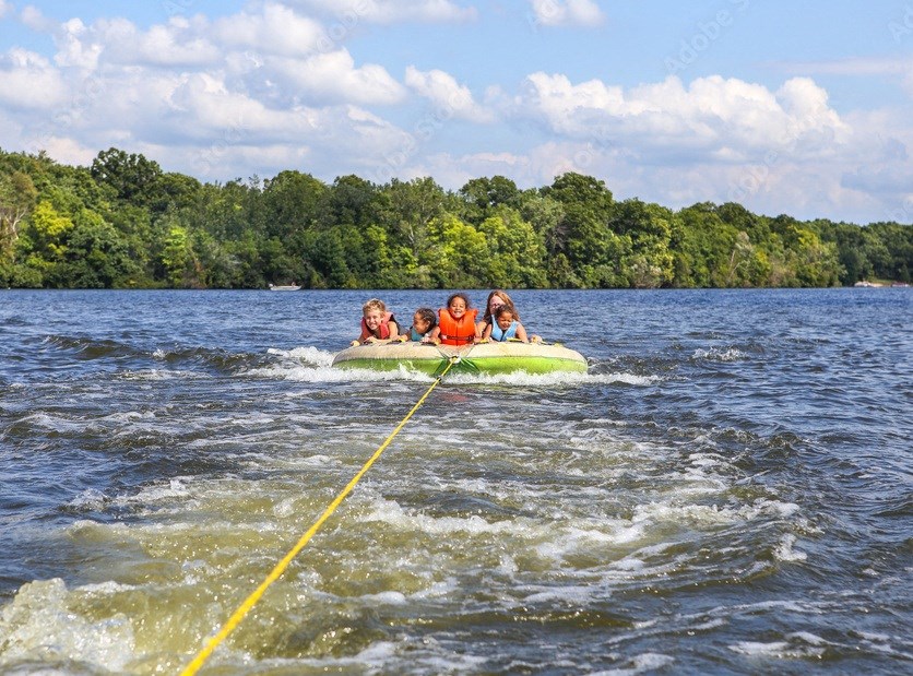 kids on an inflatable raft on Lake Murray at The Residence at Marina Bay, Irmo