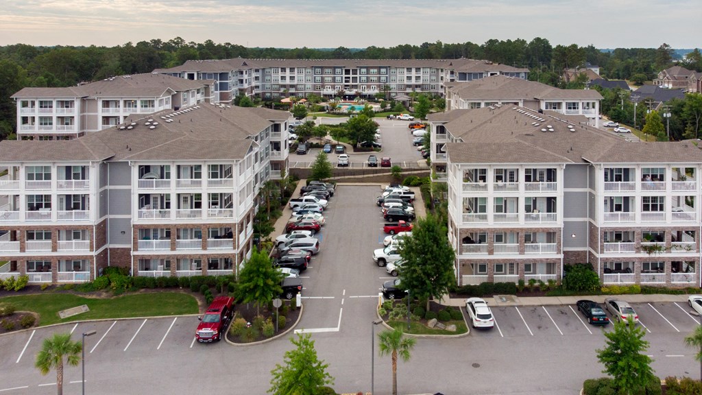 an aerial view of the gated parking lot at The Residence at Marina Bay apartments with cars parked in the parking lot at The Residence at Marina Bay, 29063