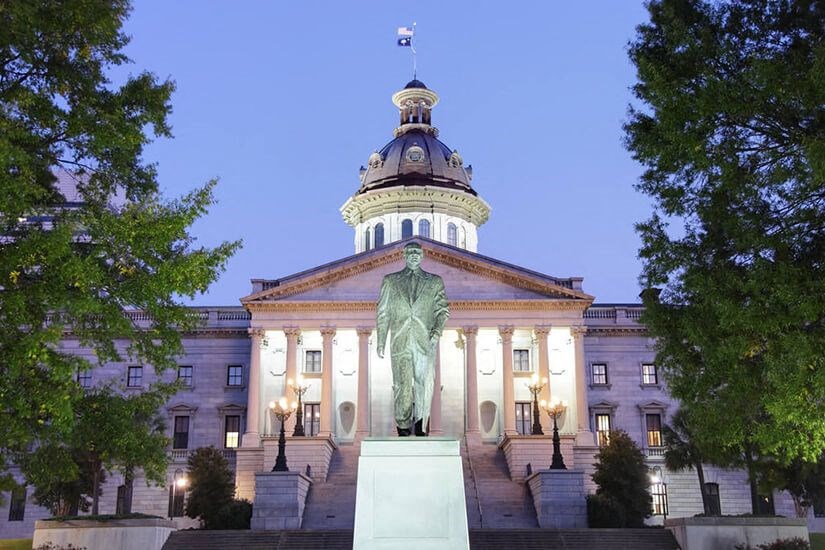 a statue in front of a government building