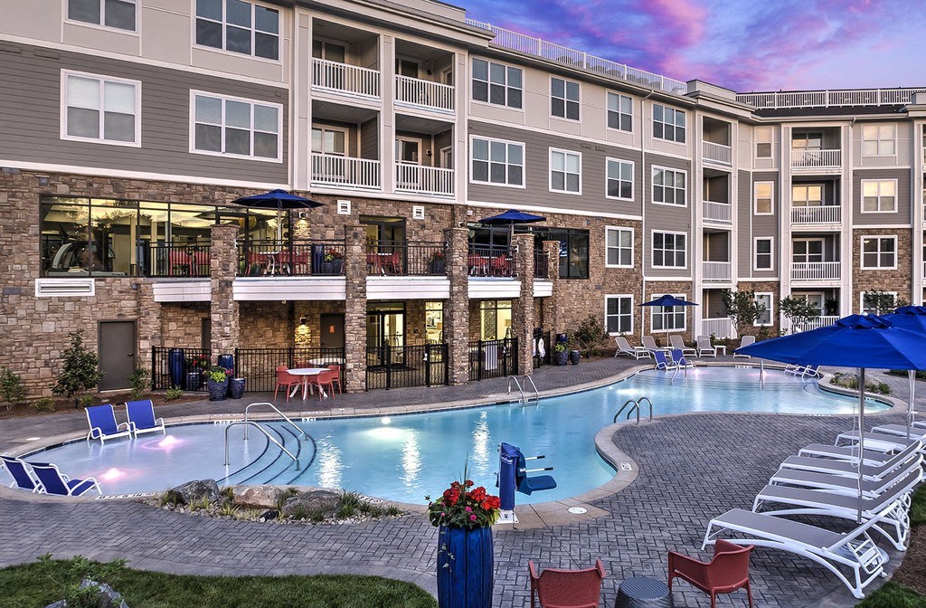 Swimming Pool With Lounge Chairs at Residence at Tailrace Marina, Mount Holly
