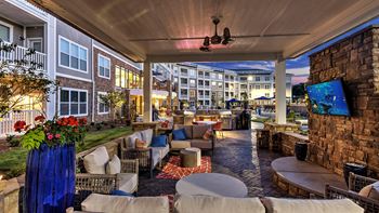 Outdoor seating area with TV at Residence at Tailrace Marina, Mount Holly, NC, 28120