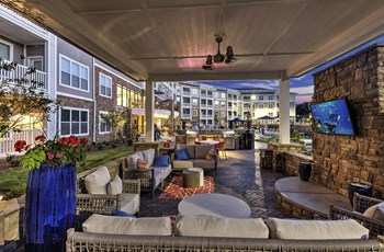 Outdoor Lounge Area With Smart TV Outdoor Lounge Area With Smart TV at Residence at Tailrace Marina, North Carolina - Photo Gallery 6