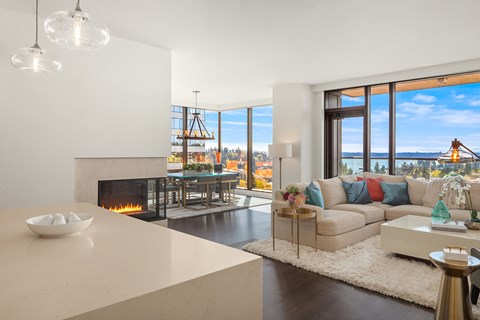 a living room with a couch and a table and a fireplace