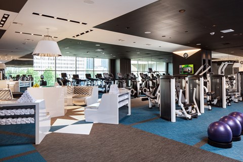 a gym with cardio machines and exercise equipment in a building a gym with cardio machines and exercise equipment in a building at Two Lincoln Tower, Bellevue, WA