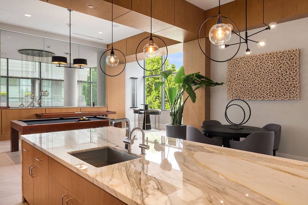a kitchen with a marble counter top and a sink at Two Lincoln Tower, Bellevue