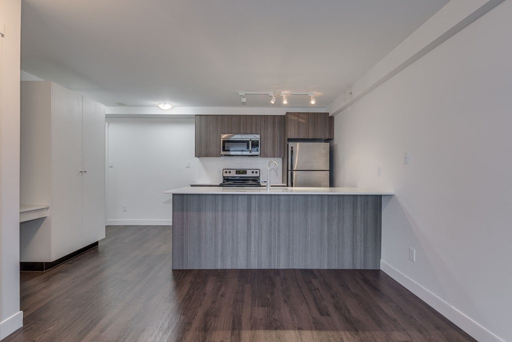 a kitchen in a bedroom plus den unit at the casey, 2100 delgany,