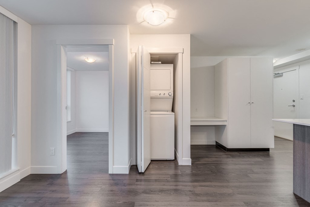 a bedroom with a medium sized bed and a mirror on the wall