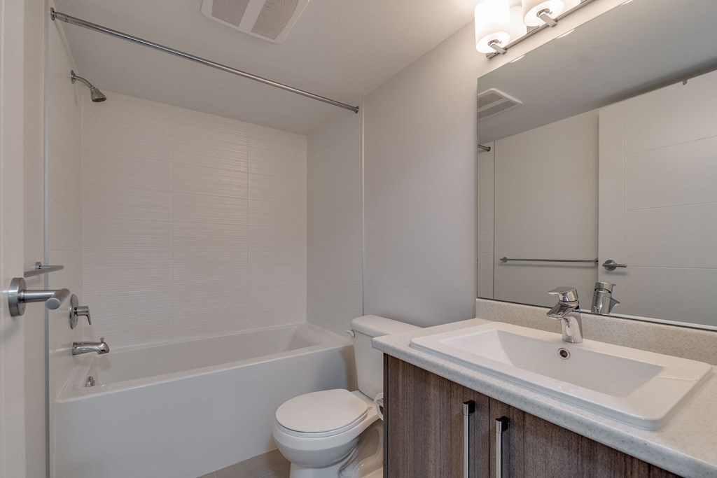 a bathroom with a sink toilet and bathtub