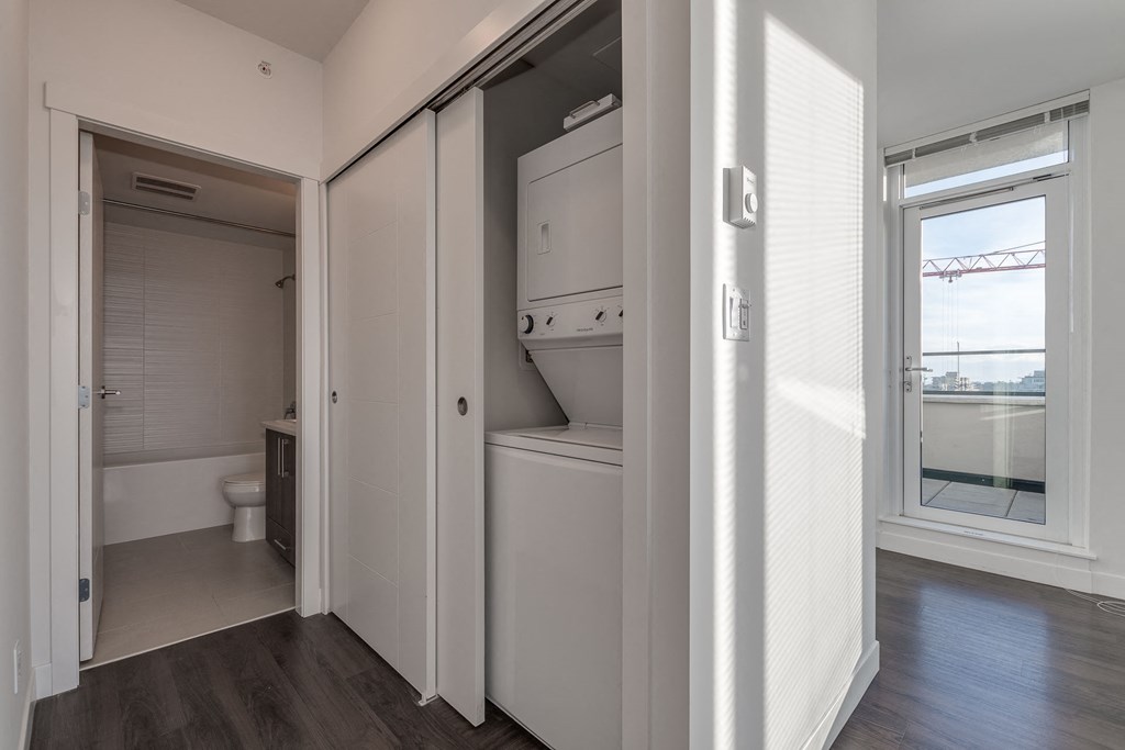 a small laundry room with a washer and dryer