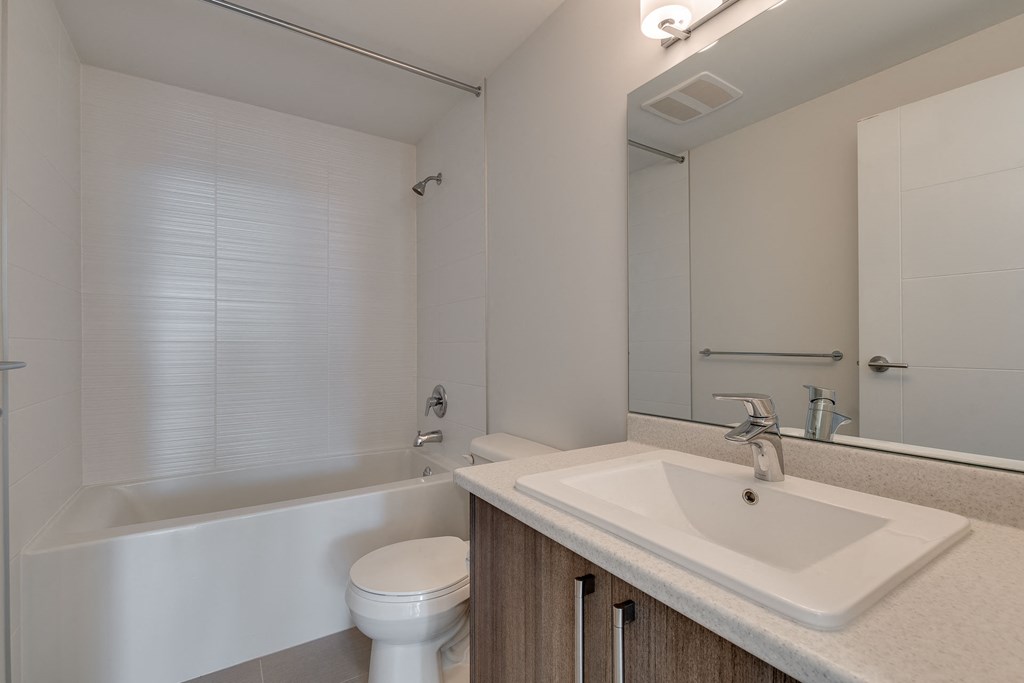 a bathroom with a sink toilet and bathtub