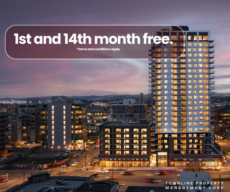 A tall building with the text "1st and 14th month free" on a banner in the foreground.