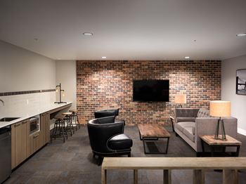 a living room filled with furniture and a flat screen tv