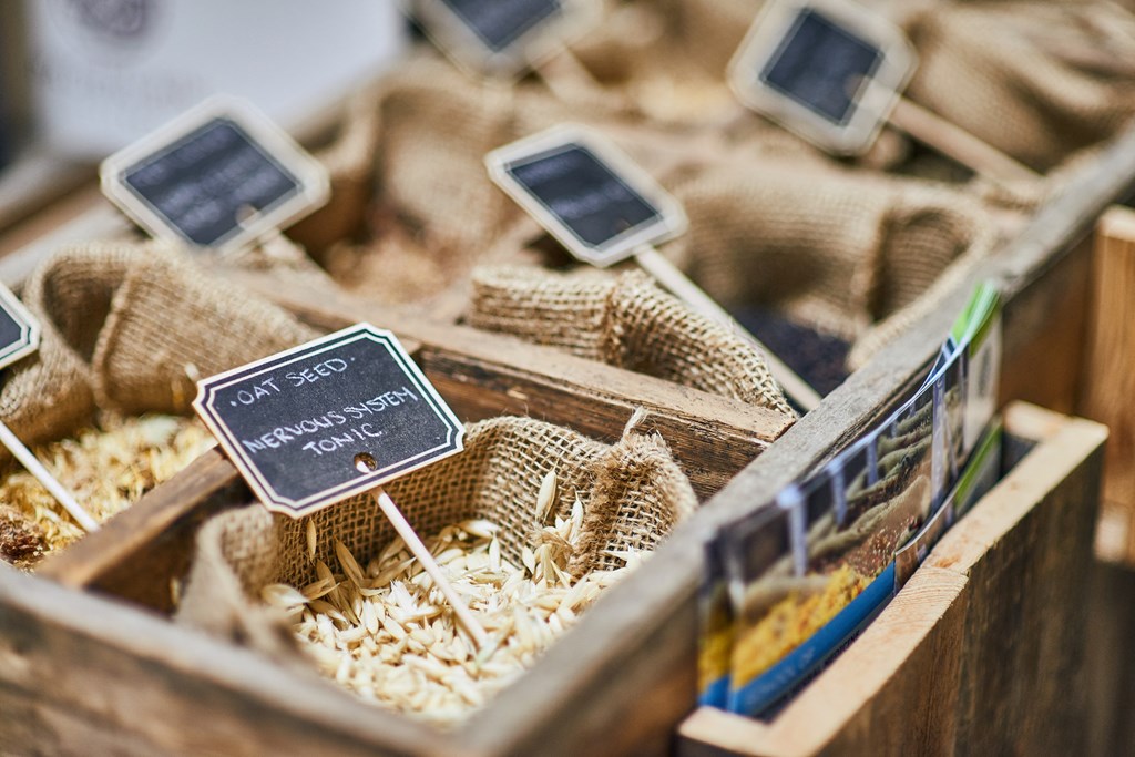 a box of rice with two cell phones on top of it