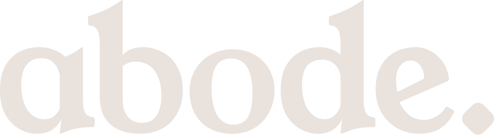 The image shows the word "abode" in large white letters on a black background.