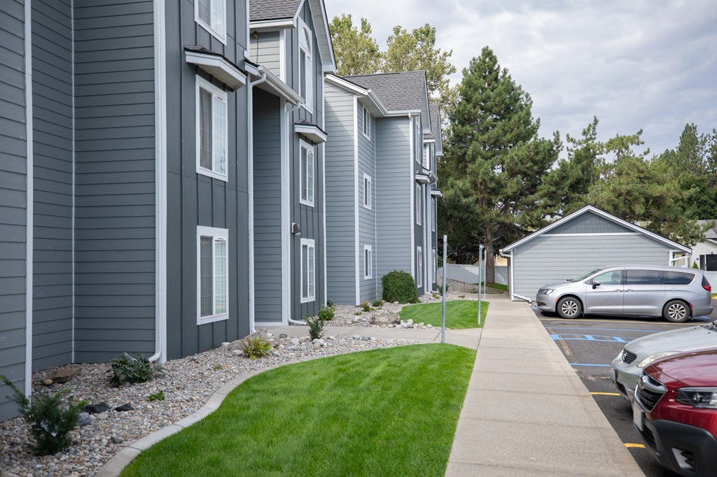 A row of houses with a car parked at Morning Glory Circle Apartments, Spokane, WA, 99208