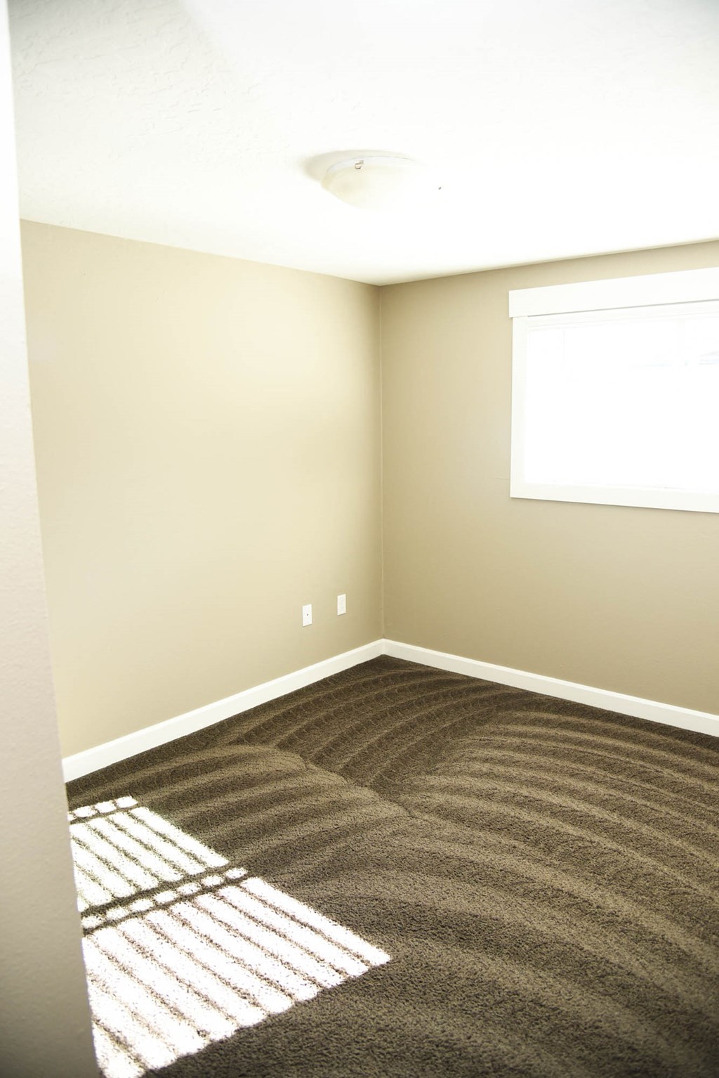Beige Carpet In Bedroom at Railhead Apartments, Spokane