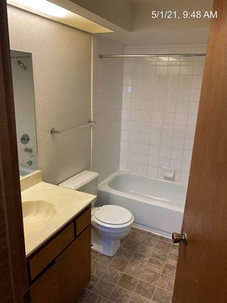 a bathroom with a sink toilet and bathtub