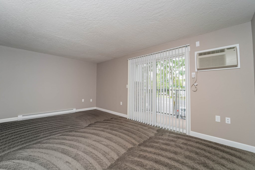 Spacious Living Room With Balcony at Railhead Apartments, Spokane, WA