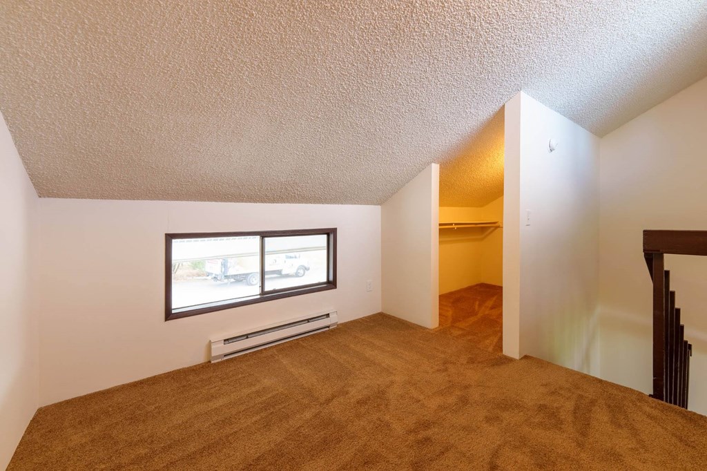 Bedroom With Closet at Hogan Apartments, Washington