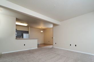 Carpeted Living Room at Quadrangle 2 Apartments, Spokane, 99208 - Photo Gallery 1