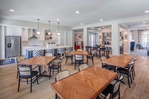 A modern dining room with wooden tables and chairs.