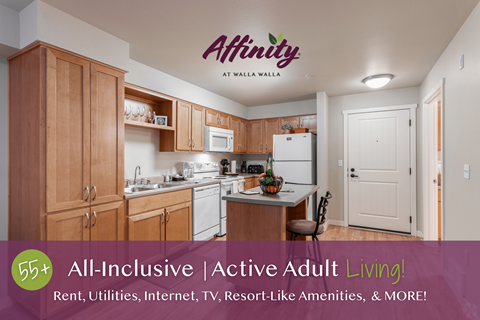 A kitchen with wooden cabinets and a sign that reads "Affinity at Walla Walla.".