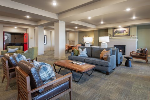 A living room with a fireplace and a couch.