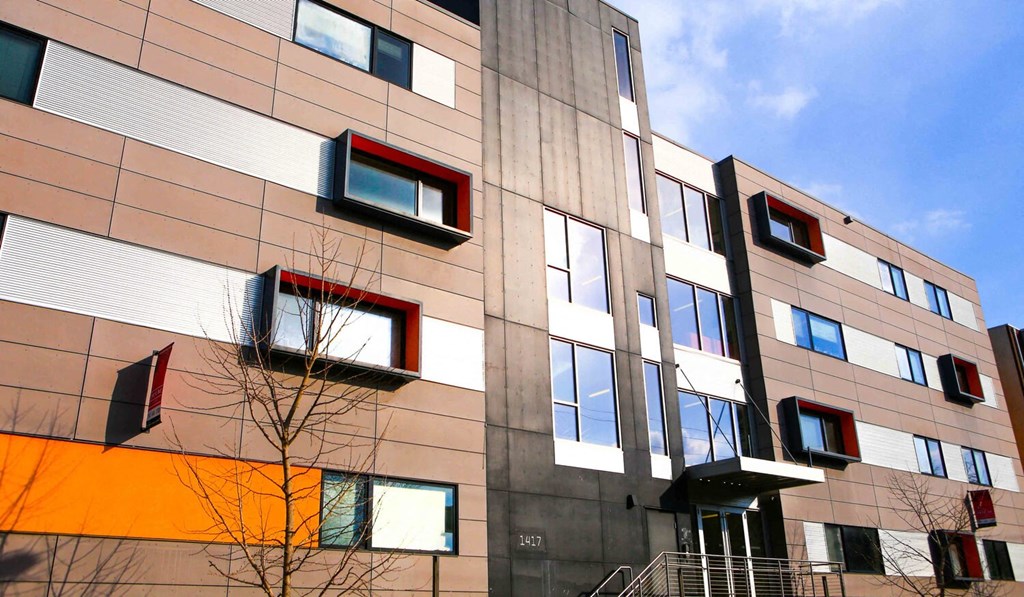 a building with colourful windows and a blue sky in the background